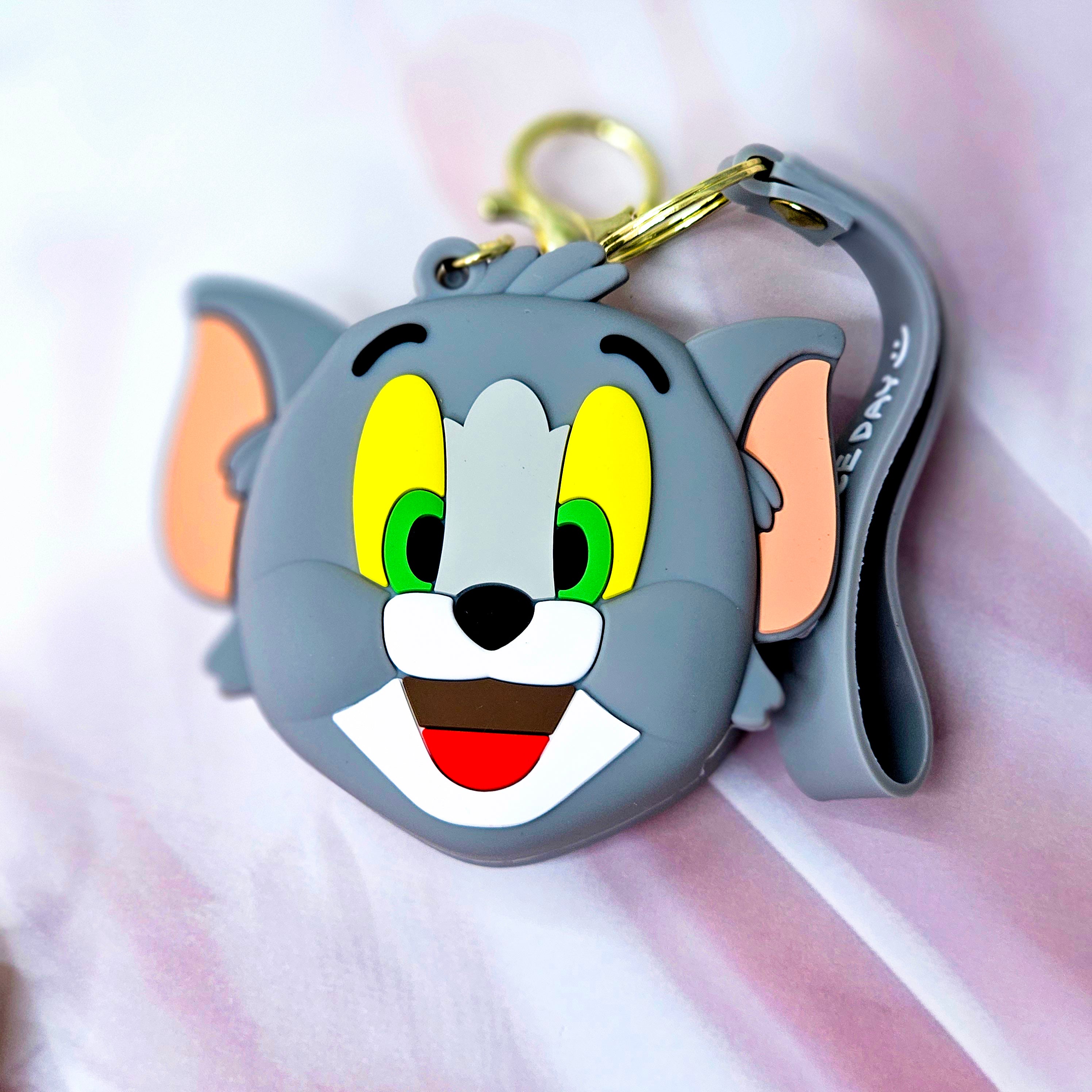 Durable silicone Tom character coin purse and keychain, a unique accessory for kids' bags or keys, combining style and utility. www.usmile.com